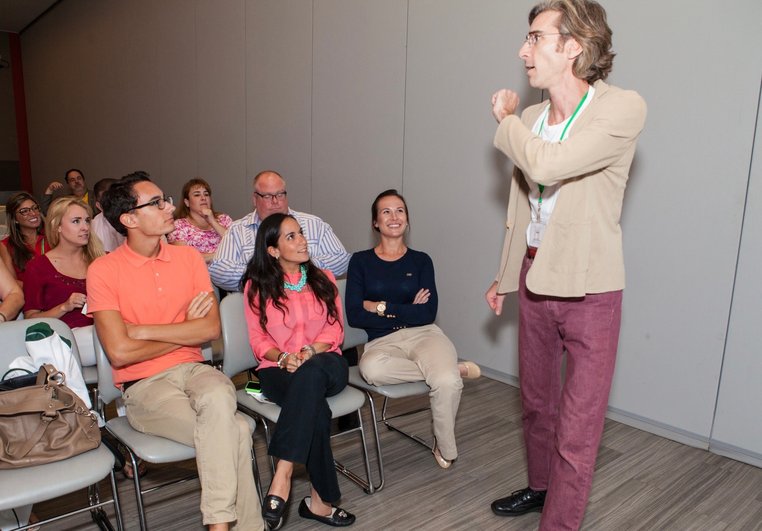 Presenter engaging seated audience at conference
