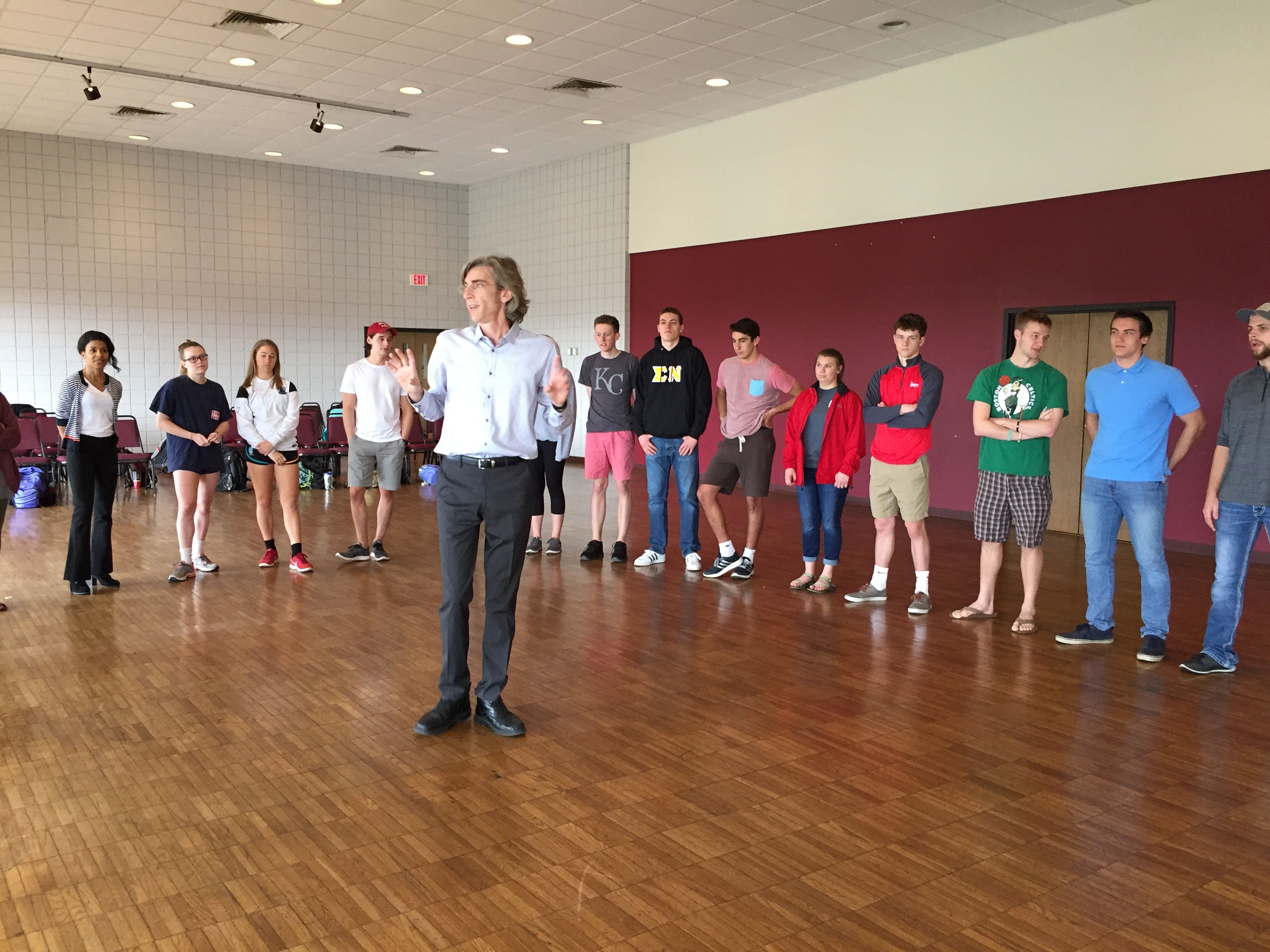 Facilitator leading group in gymnasium